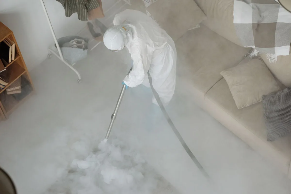 Biohazard cleanup technician in protective equipment, Wildwood, MO